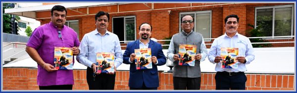 Yashaswi Group leadership and guests unveiling the Independence Day edition of Yashogatha 2026 magazine in Pune